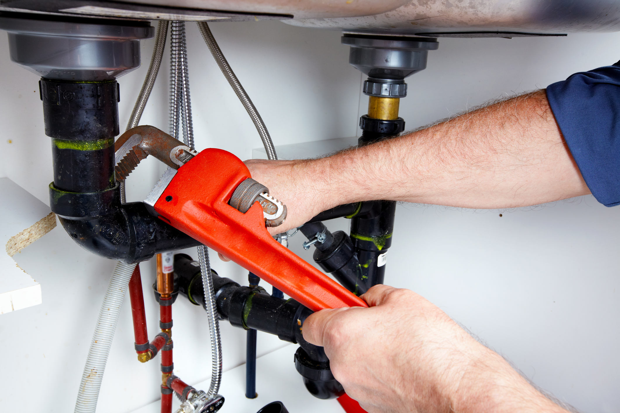 hands-of-plumber-with-a-wrench-35582023